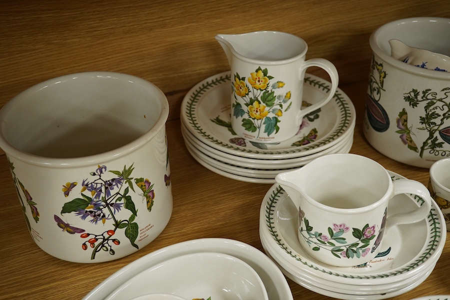 A quantity of Portmeirion tableware to include oval dishes, cups, saucers and dinner plates. Condition - mostly fair, some cracks